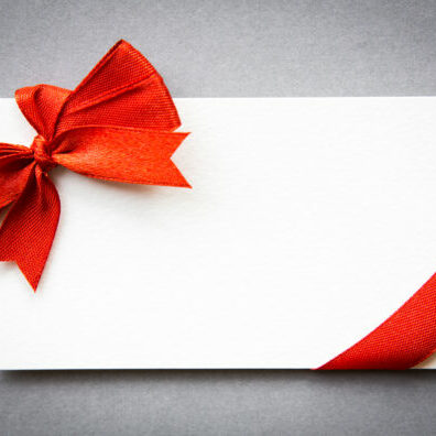 Card with red ribbons bows