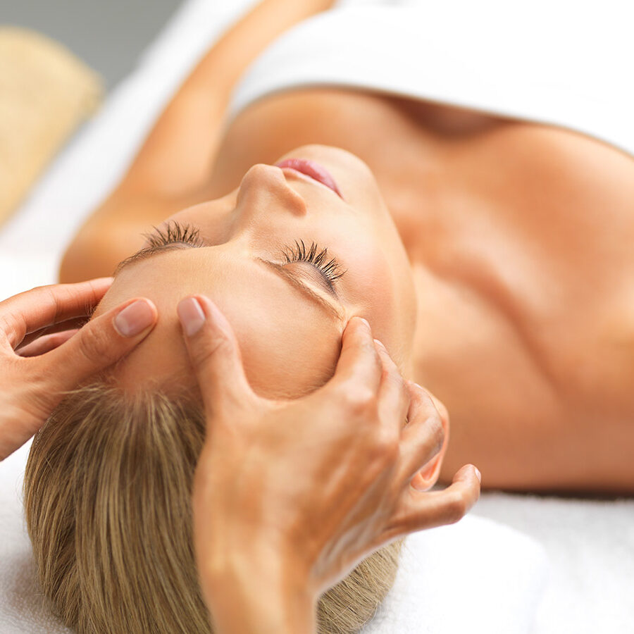 A beautiful young woman relaxing in a spa